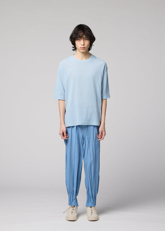 A model wears the IM MEN CREPE TUCK JERSEY crepe-tuck-jersey-top-black.
