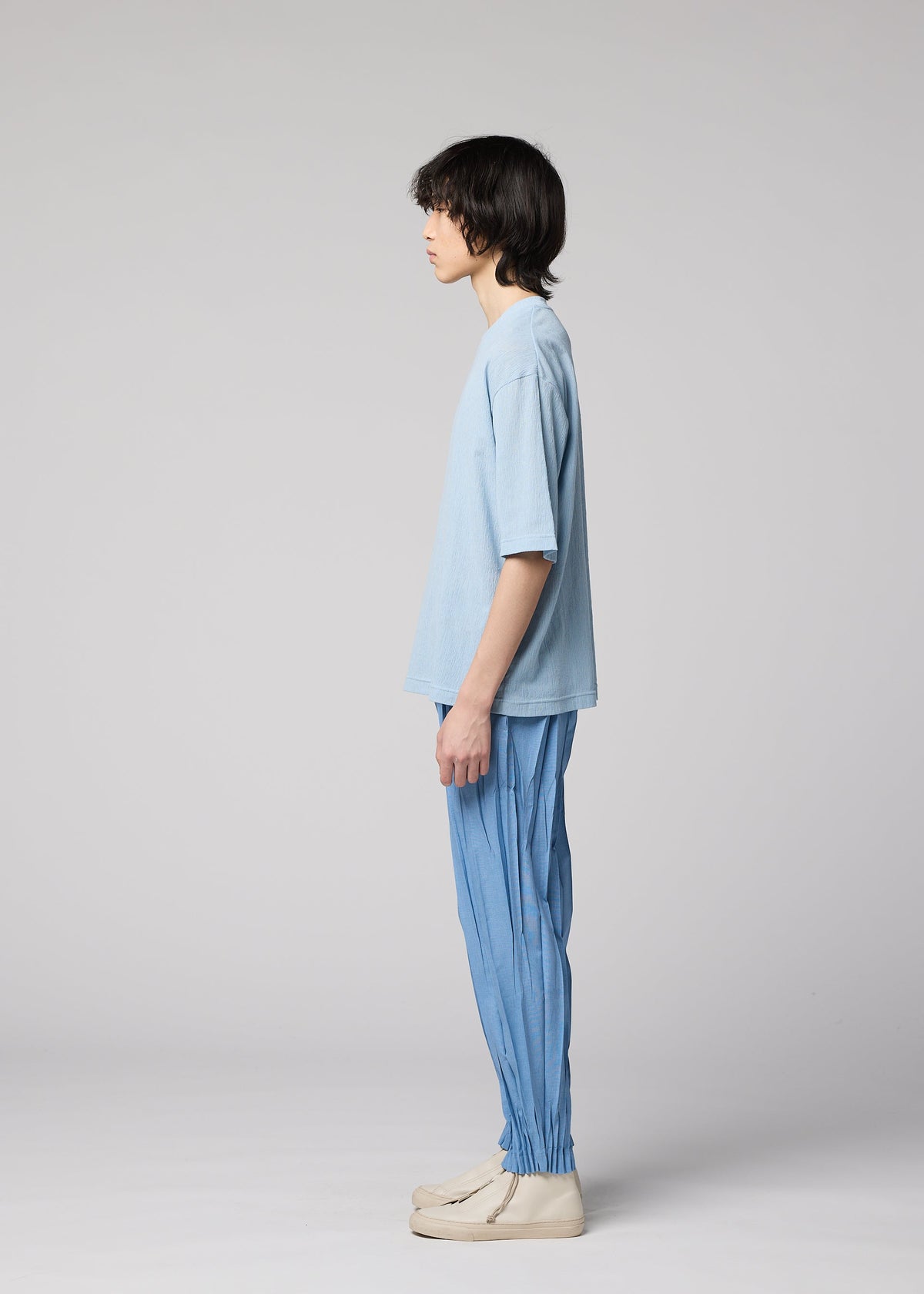 A model wears the IM MEN CREPE TUCK JERSEY crepe-tuck-jersey-top-black.