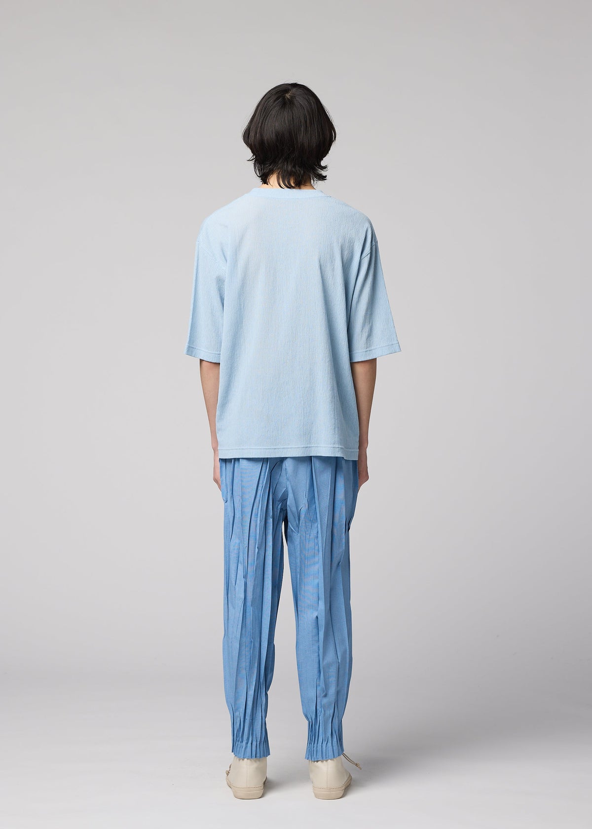 A model wears the IM MEN CREPE TUCK JERSEY crepe-tuck-jersey-top-black.