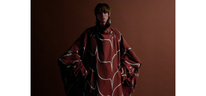 Centre: Model wearing EARTH Coat Red, confident pose against a brown background.