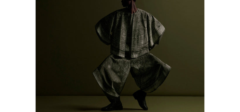 Centre: Model wearing KAIYU Jacket and Trousers in Khaki, confident pose against a dark green background.