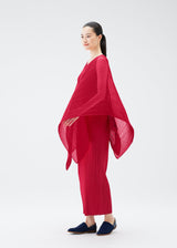 A model wears the PLEATS PLEASE ISSEY MIYAKE COLORFUL MADAME T SMALL stole.