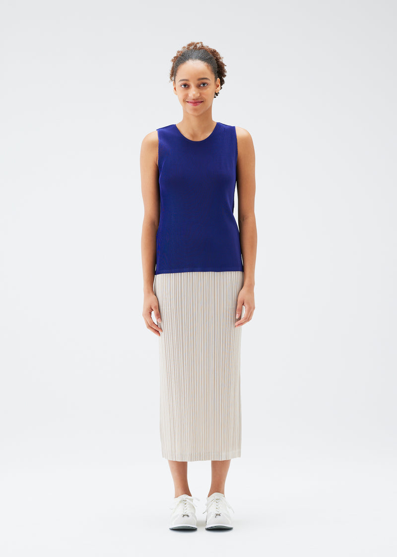 A model wears the PLEATS PLEASE ISSEY MIYAKE  MIST JULY top