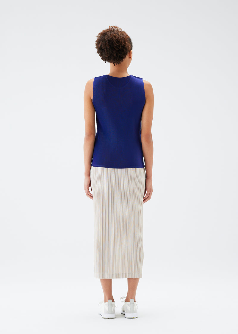 A model wears the PLEATS PLEASE ISSEY MIYAKE  MIST JULY top