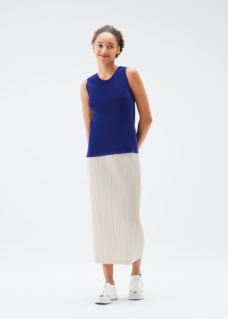 A model wears the PLEATS PLEASE ISSEY MIYAKE  MIST JULY top