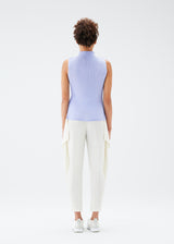 A model wears the PLEATS PLEASE ISSEY MIYAKE  MIST JULY top