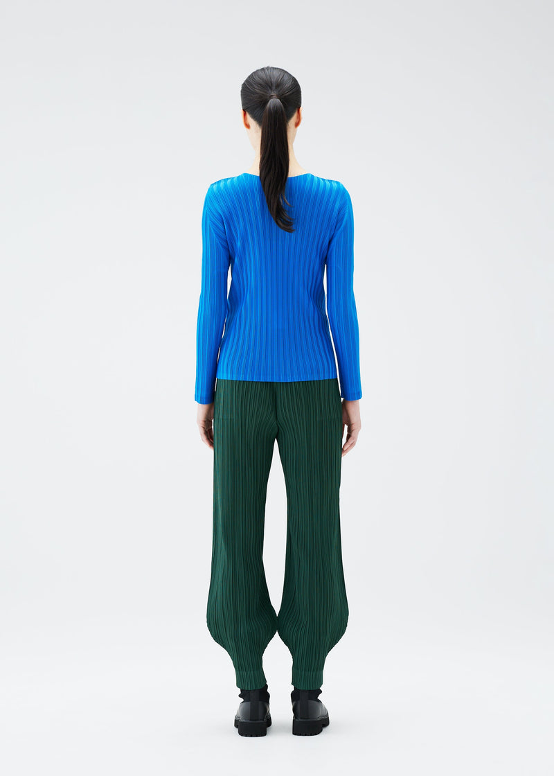 A model wears the PLEATS PLEASE ISSEY MIYAKE RIB PLEATS OCTOBER top.