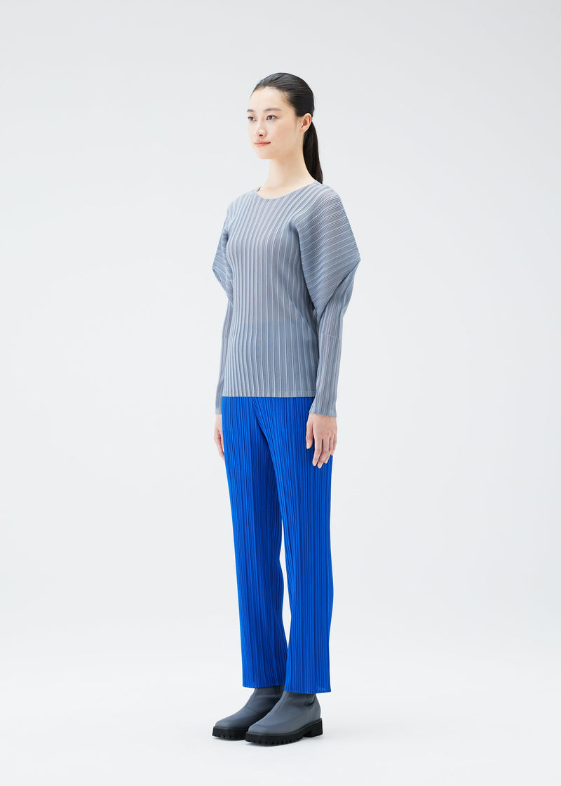 A model wears the PLEATS PLEASE ISSEY MIYAKE RIB PLEATS OCTOBER top.