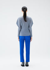 A model wears the PLEATS PLEASE ISSEY MIYAKE RIB PLEATS OCTOBER top.