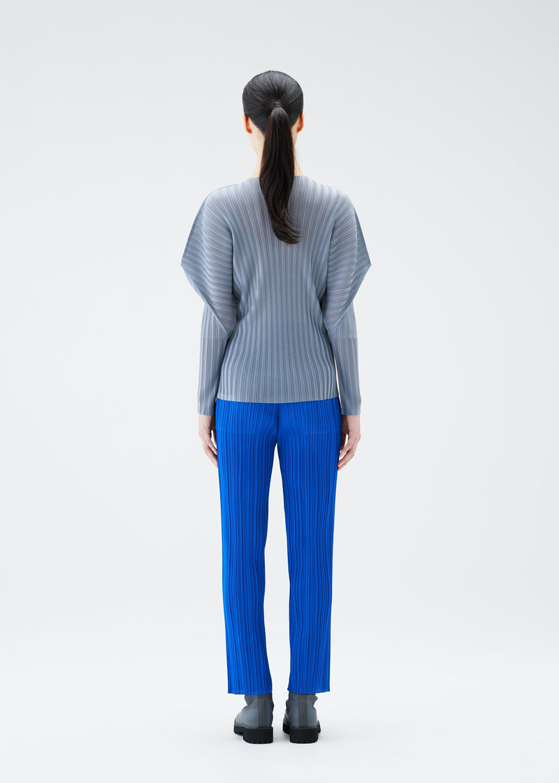 A model wears the PLEATS PLEASE ISSEY MIYAKE RIB PLEATS OCTOBER top.