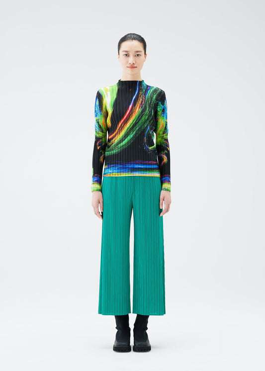 A model wears the PLEATS PLEASE ISSEY MIYAKE SPECTRUM RIB top.