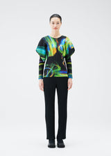 A model wears the PLEATS PLEASE ISSEY MIYAKE SPECTRUM RIB top.