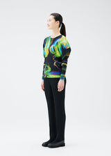 A model wears the PLEATS PLEASE ISSEY MIYAKE SPECTRUM RIB top.