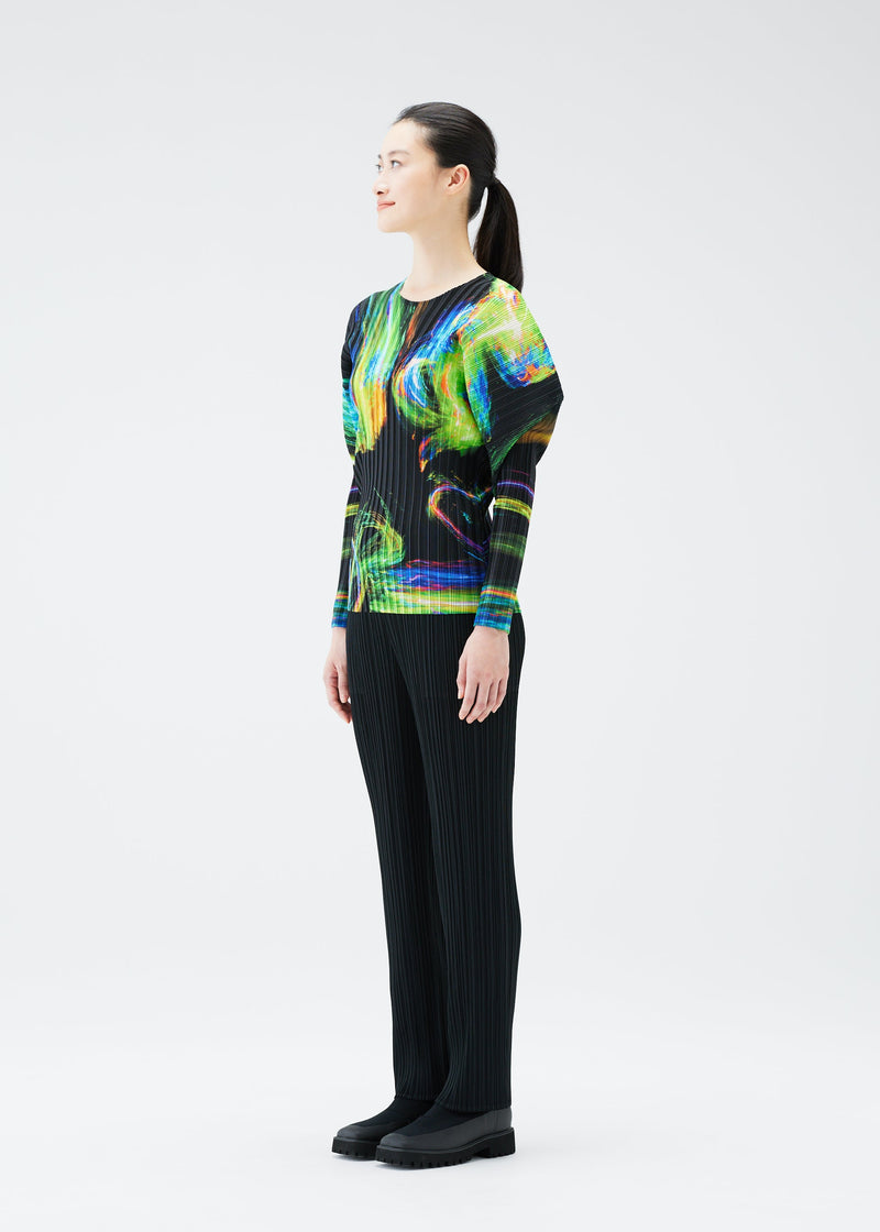 A model wears the PLEATS PLEASE ISSEY MIYAKE SPECTRUM RIB top.