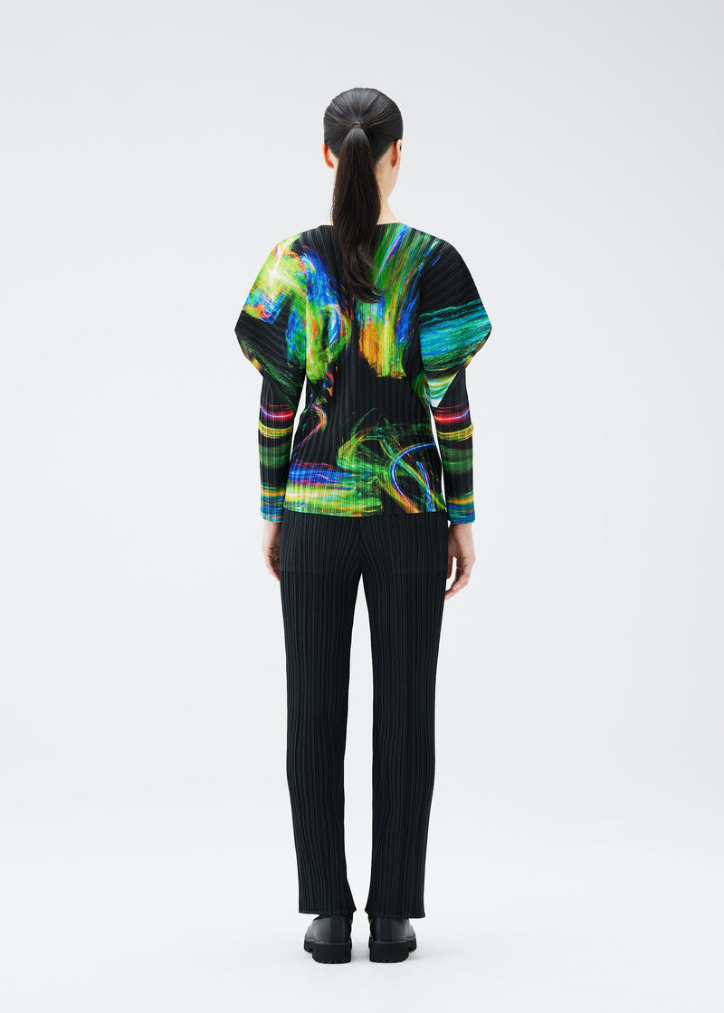 A model wears the PLEATS PLEASE ISSEY MIYAKE SPECTRUM RIB top.