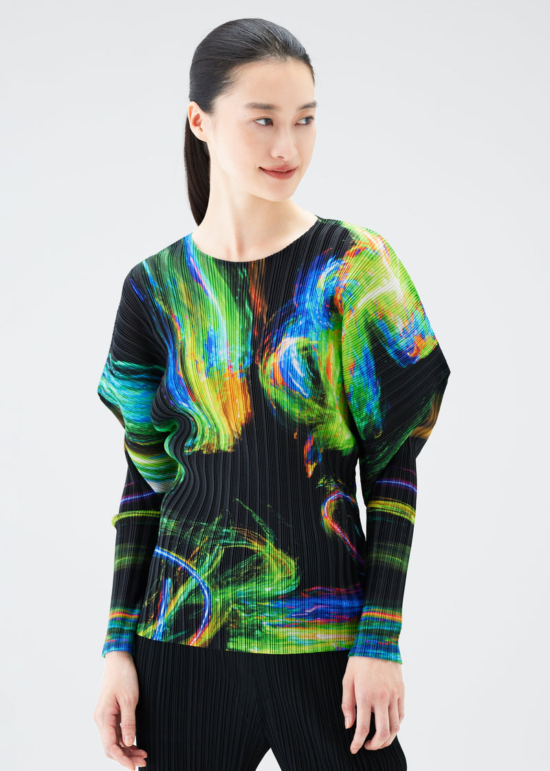 A model wears the PLEATS PLEASE ISSEY MIYAKE SPECTRUM RIB top.