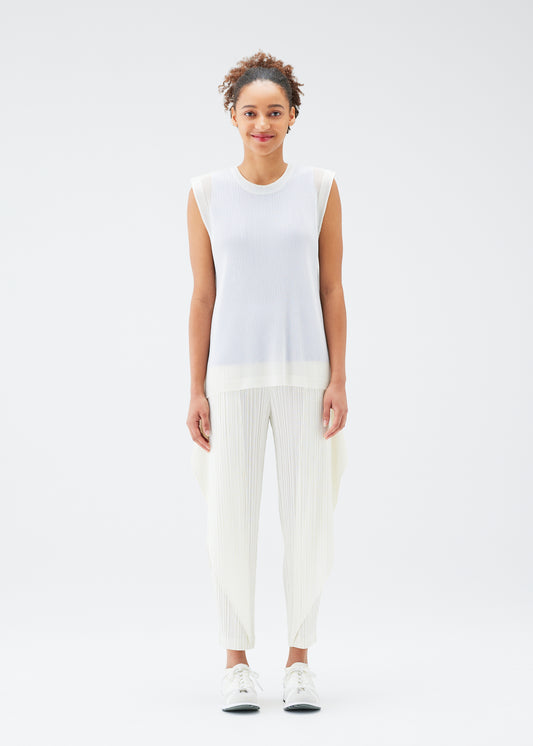 A model wears the PLEATS PLEASE ISSEY MIYAKE  TATAMI JULY top