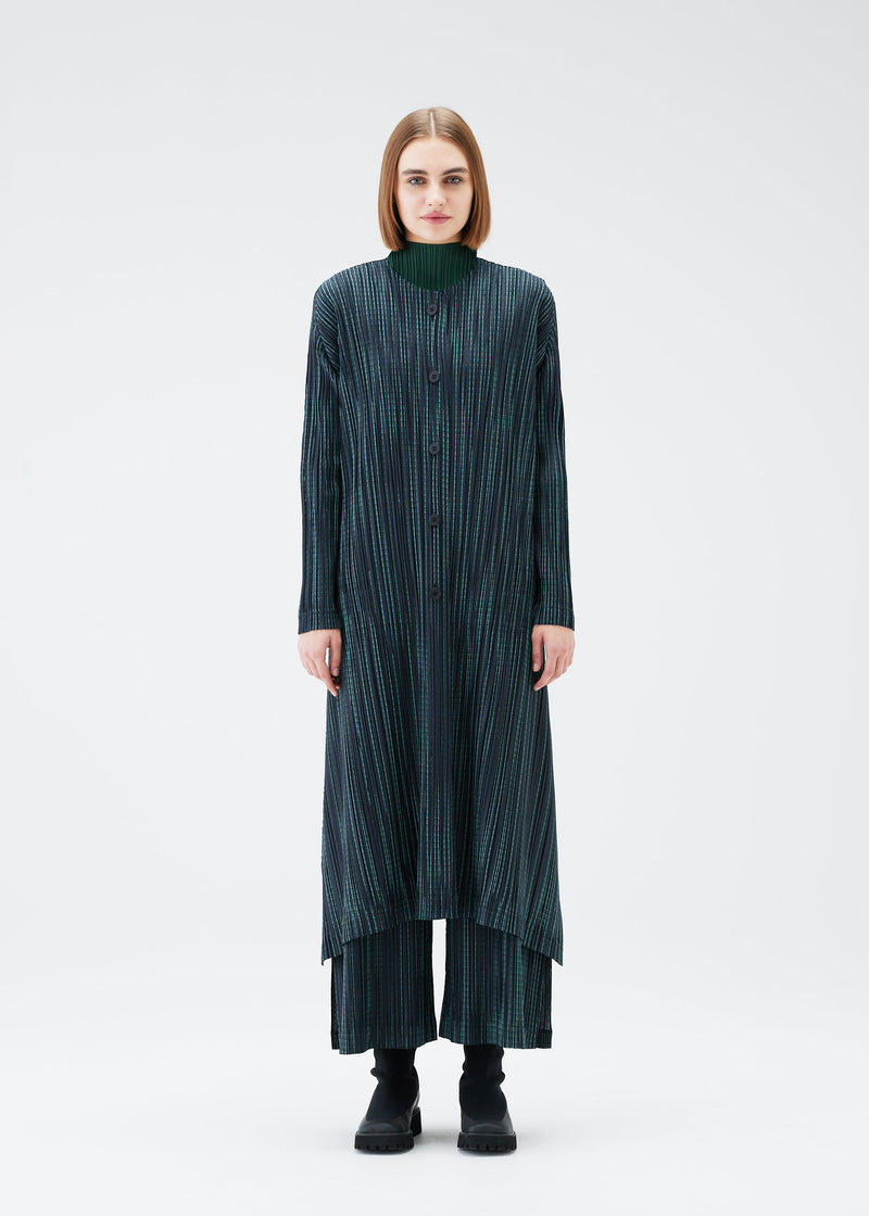 A model wears the PLEATS PLEASE ISSEY MIYAKE METEOR SHOWER coat.