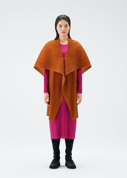 A model wears the PLEATS PLEASE ISSEY MIYAKE MONTHLY COLORS NOVEMBER vest.