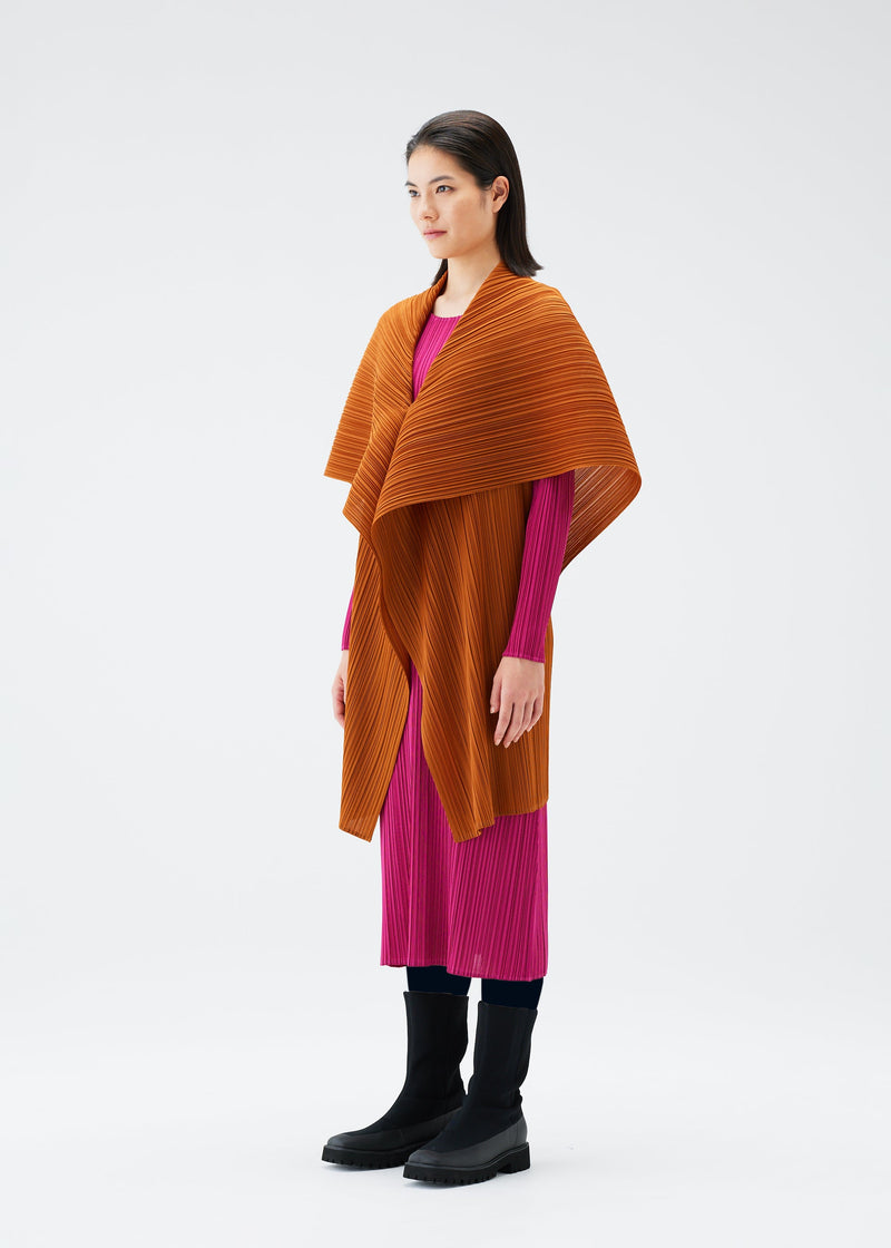 A model wears the PLEATS PLEASE ISSEY MIYAKE MONTHLY COLORS NOVEMBER vest.