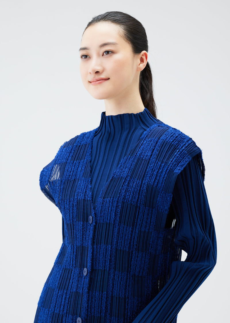 A model wears the PLEATS PLEASE ISSEY MIYAKE NEBULA vest.