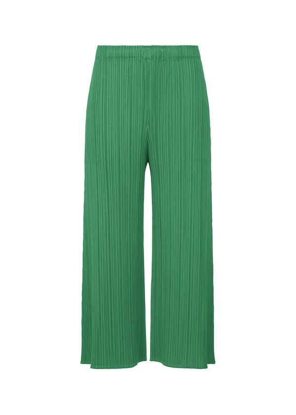 A product shot of the PLEATS PLEASE ISSEY MIYAKE MONTHLY COLORS NOVEMBER trousers in bright green (59).