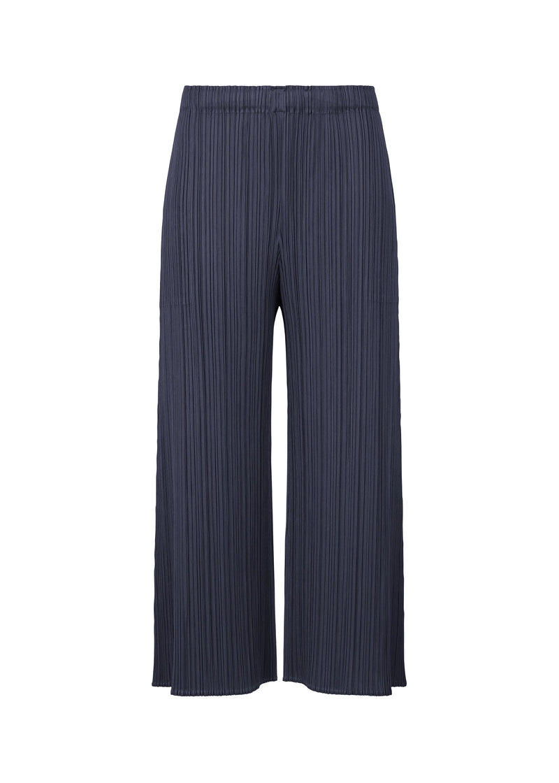 A product shot of the PLEATS PLEASE ISSEY MIYAKE MONTHLY COLORS NOVEMBER trousers in dark navy (79).