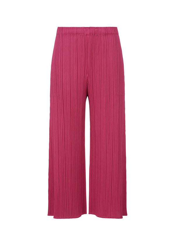 A product shot of the PLEATS PLEASE ISSEY MIYAKE MONTHLY COLORS NOVEMBER trousers in magenta (83).