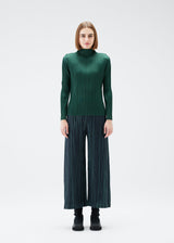 A model wears the PLEATS PLEASE ISSEY MIYAKE METEOR SHOWER trousers.