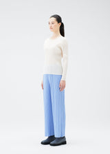 A model wears the PLEATS PLEASE ISSEY MIYAKE NEBULA trousers.