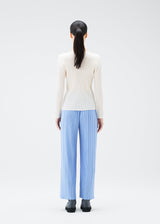 A model wears the PLEATS PLEASE ISSEY MIYAKE NEBULA trousers.