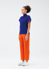 A model wears the PLEATS PLEASE ISSEY MIYAKE  THICKER BOTTOMS 1 trousers