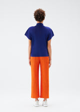 A model wears the PLEATS PLEASE ISSEY MIYAKE  THICKER BOTTOMS 1 trousers