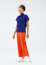 A model wears the PLEATS PLEASE ISSEY MIYAKE  THICKER BOTTOMS 1 trousers