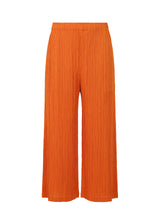 A product shot of the PLEATS PLEASE ISSEY MIYAKE  THICKER BOTTOMS 1 trousers in dark orange (33)