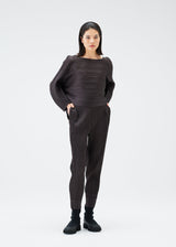 A model wears the PLEATS PLEASE ISSEY MIYAKE UFO trousers.