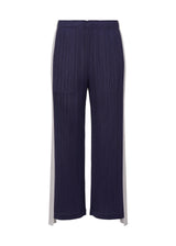 A product shot of the PLEATS PLEASE ISSEY MIYAKE  COMET trousers in navy (75)