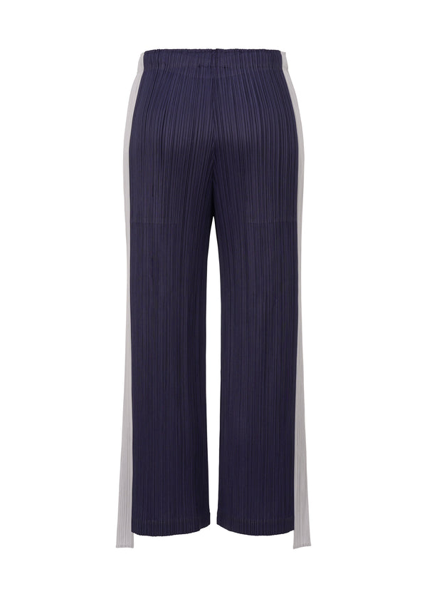 A detail shot of the PLEATS PLEASE ISSEY MIYAKE  COMET trousers