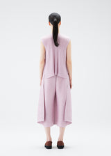 A model wears the PLEATS PLEASE ISSEY MIYAKE  SOLAR FLARE trousers