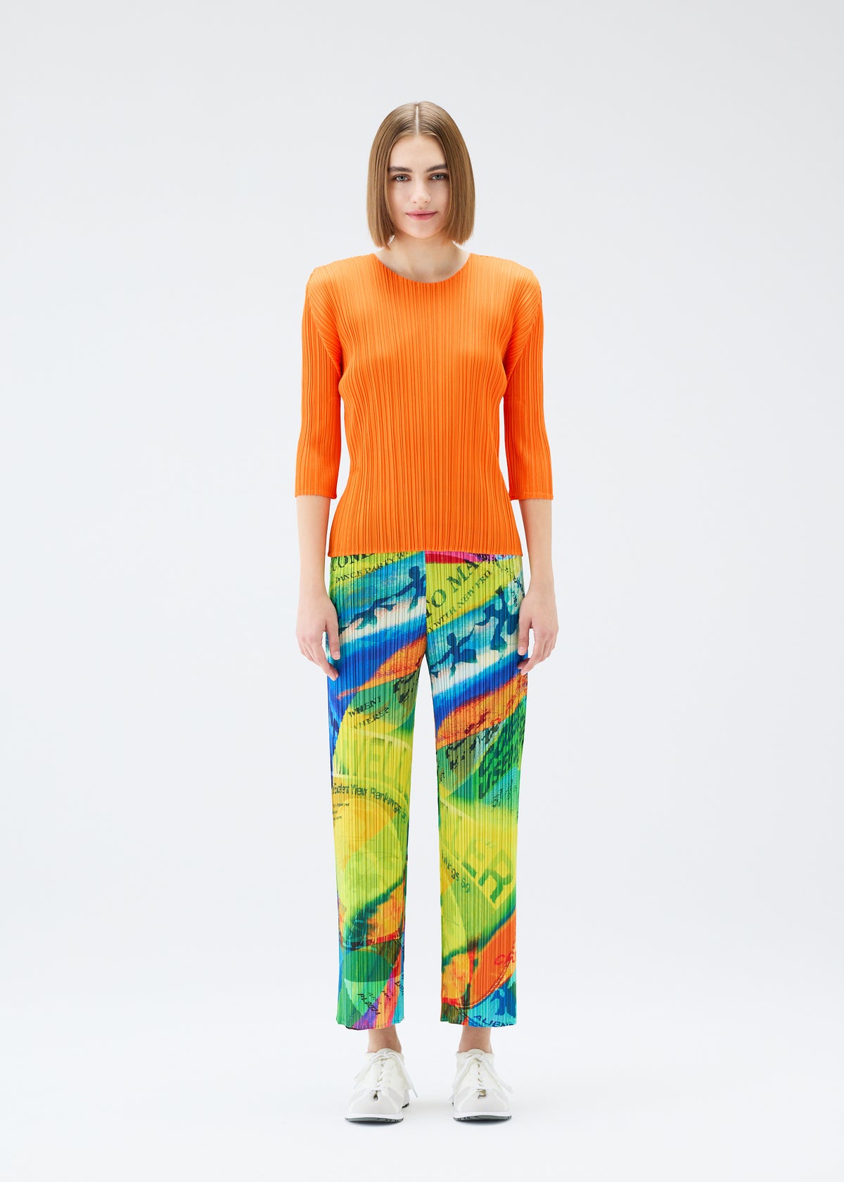 A model wears the PLEATS PLEASE ISSEY MIYAKE  VOYAGER trousers