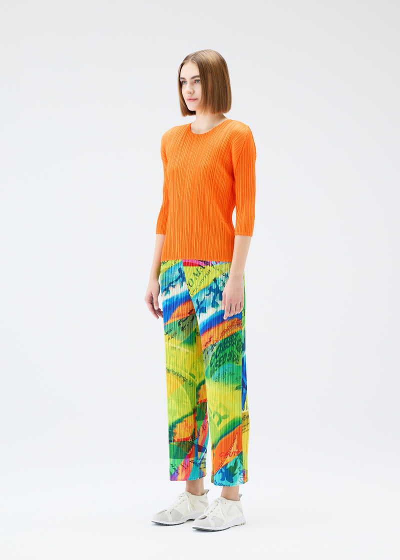 A model wears the PLEATS PLEASE ISSEY MIYAKE  VOYAGER trousers