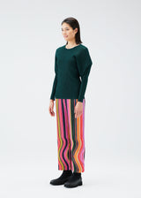 A model wears the PLEATS PLEASE ISSEY MIYAKE WARP trousers.