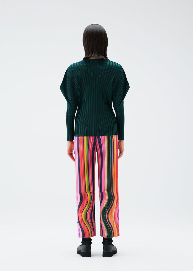 A model wears the PLEATS PLEASE ISSEY MIYAKE WARP trousers.