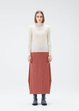 A model wears the PLEATS PLEASE ISSEY MIYAKE MONTHLY COLORS DECEMBER skirt.