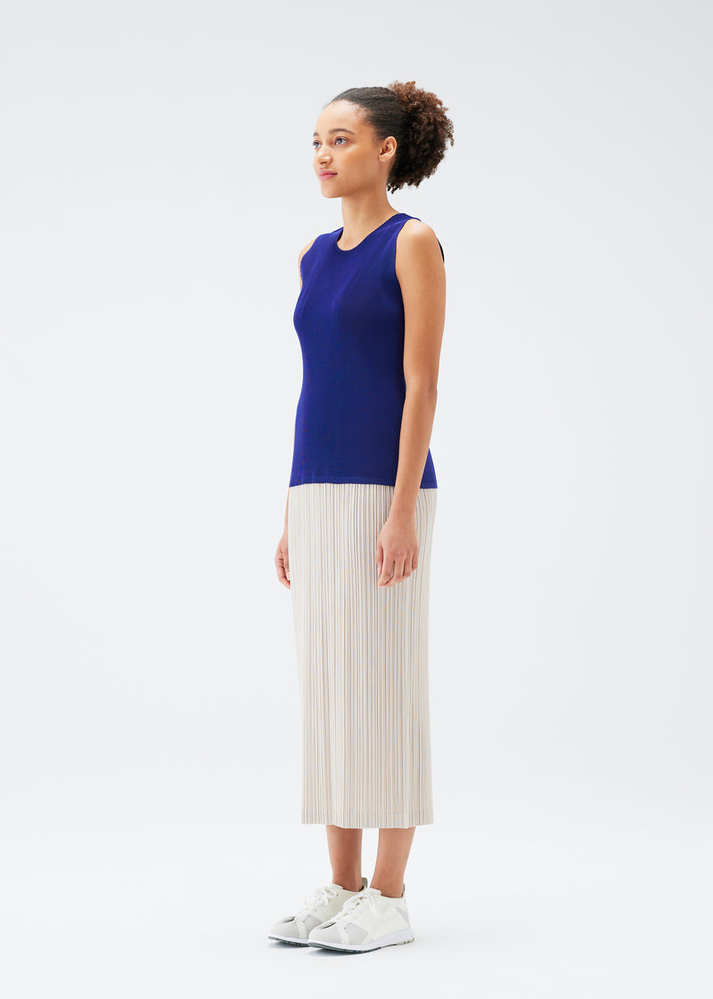 A model wears the PLEATS PLEASE ISSEY MIYAKE  THICKER BOTTOMS 1 skirt