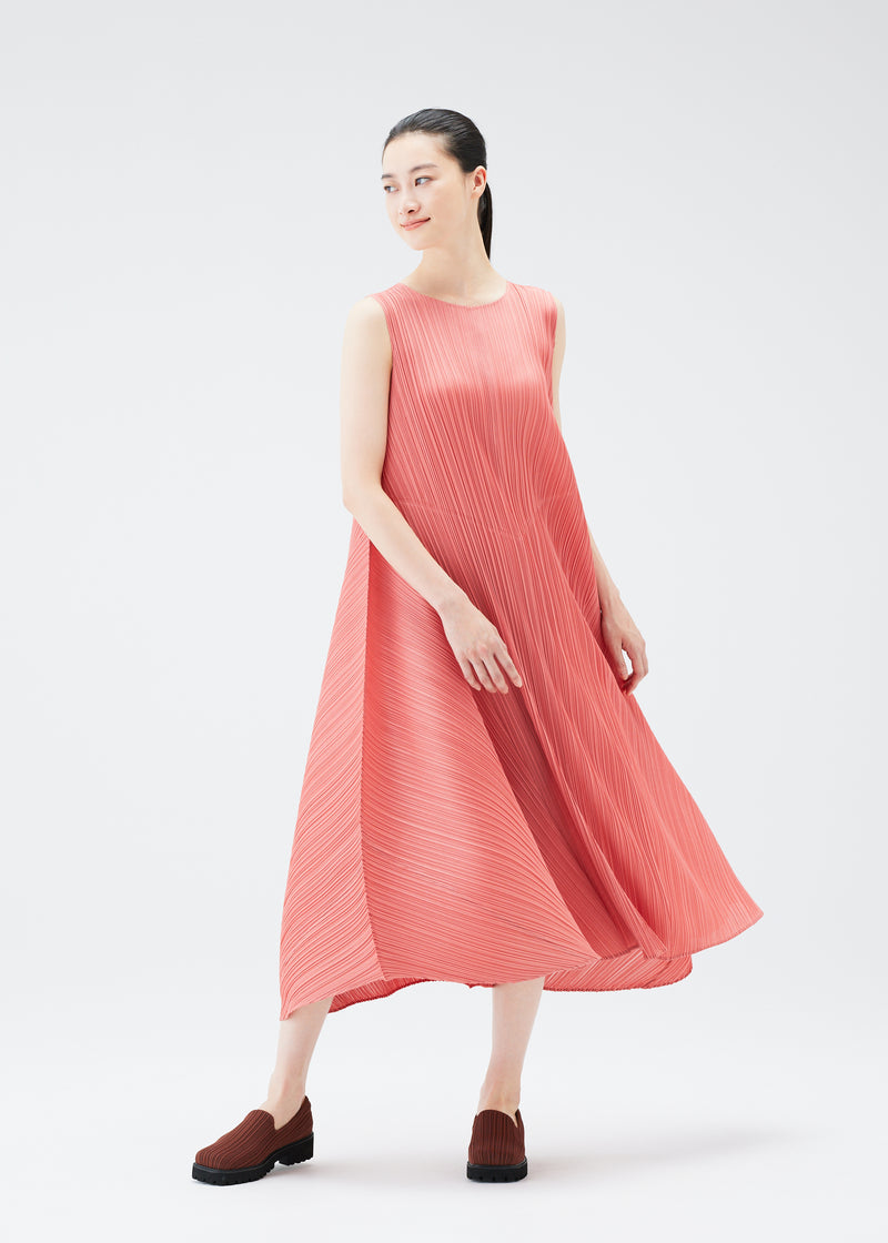 A model wears the PLEATS PLEASE ISSEY MIYAKE  SOLAR FLARE dress