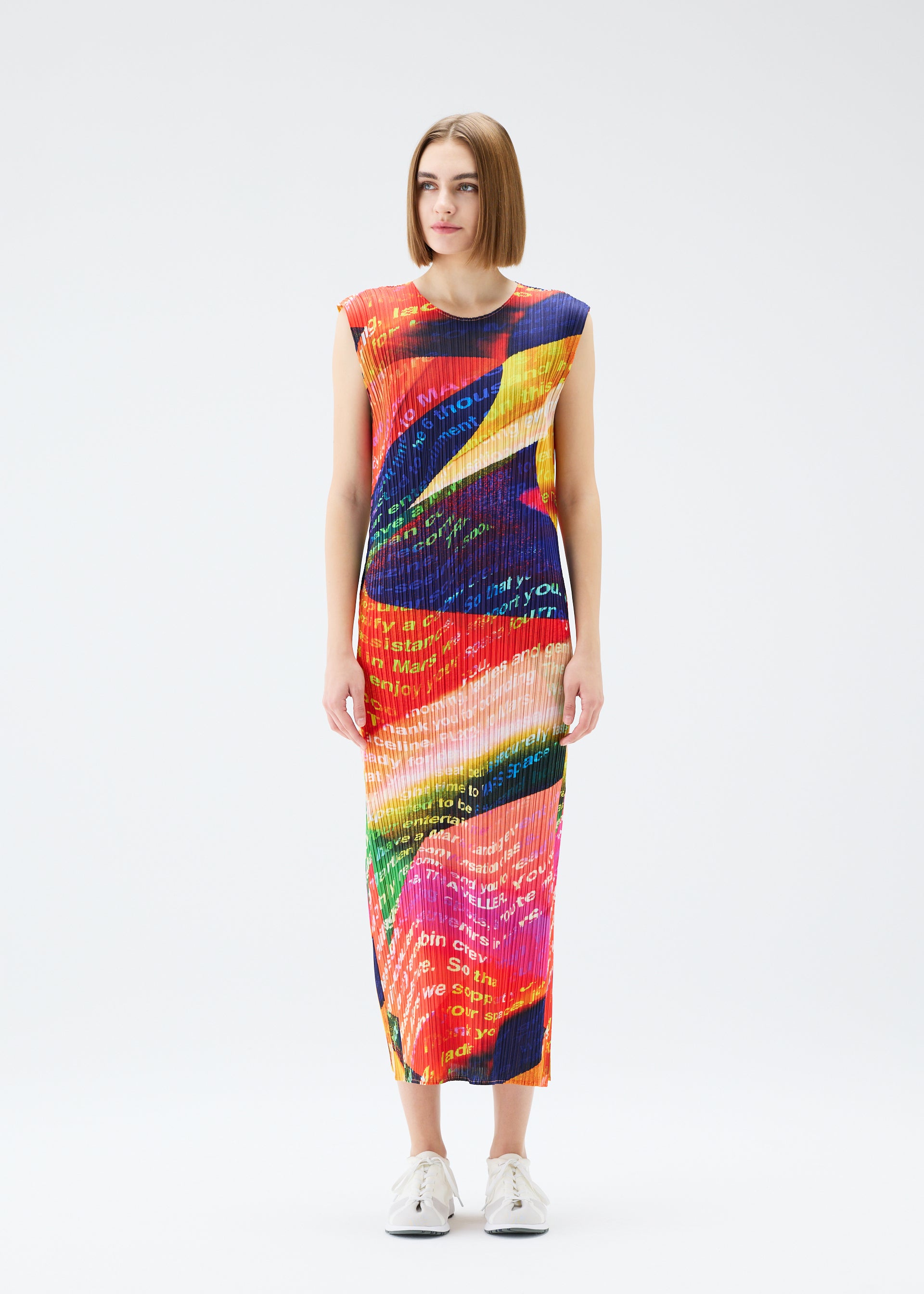 A model wears the PLEATS PLEASE ISSEY MIYAKE  VOYAGER dress