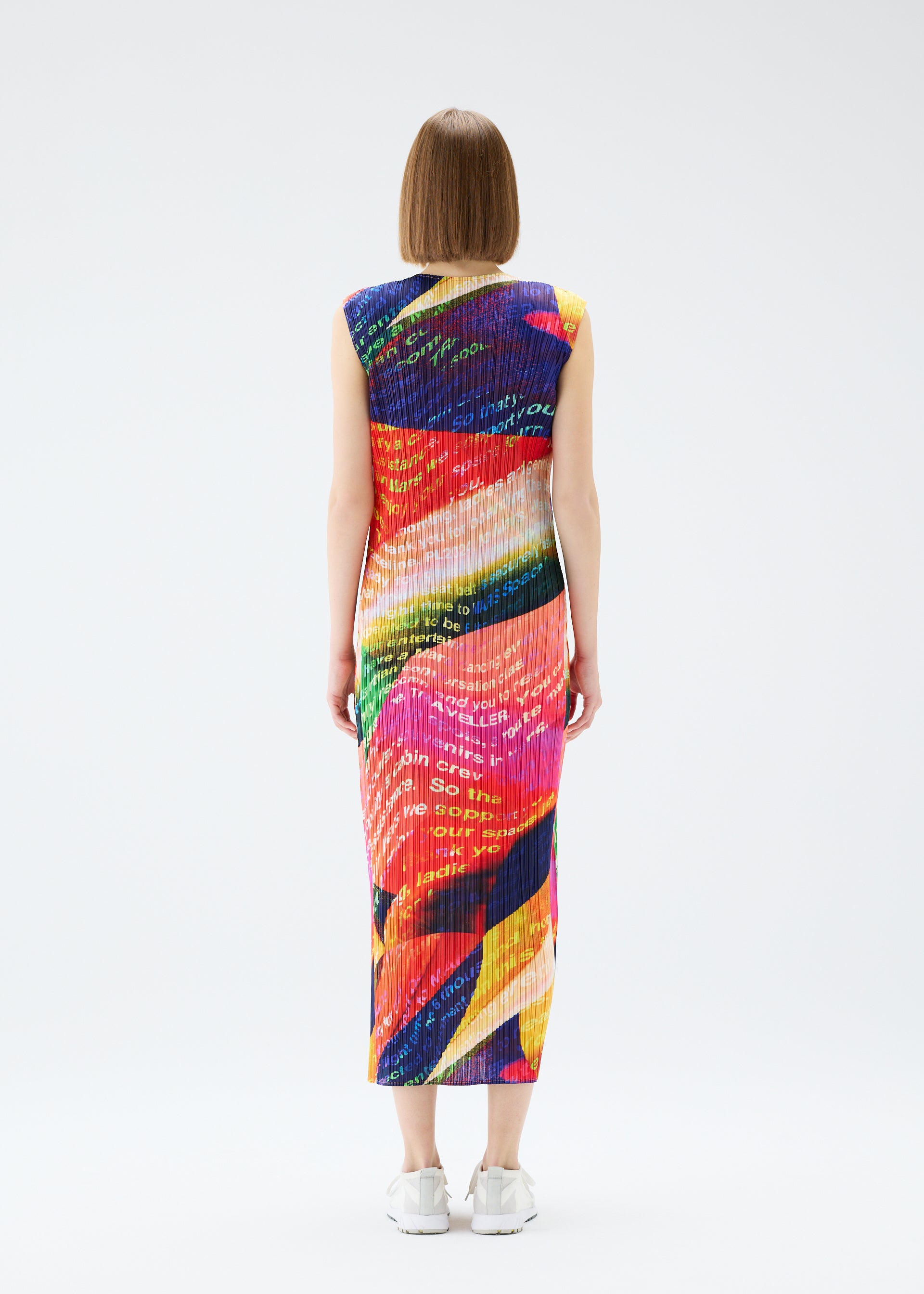 A model wears the PLEATS PLEASE ISSEY MIYAKE  VOYAGER dress