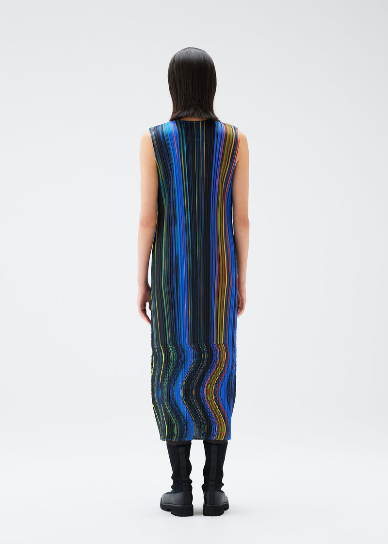 A model wears the PLEATS PLEASE ISSEY MIYAKE WARP dress.