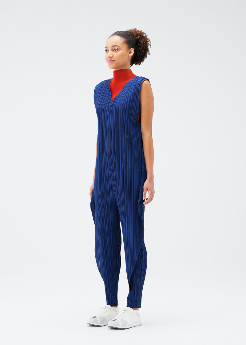 A model wears the PLEATS PLEASE ISSEY MIYAKE  THICKER BOTTOMS 1 jumpsuit